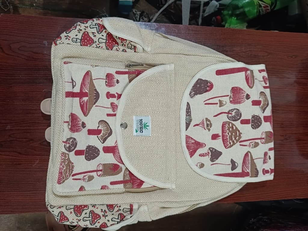 Hemp backpack with rust mushroom print on wood